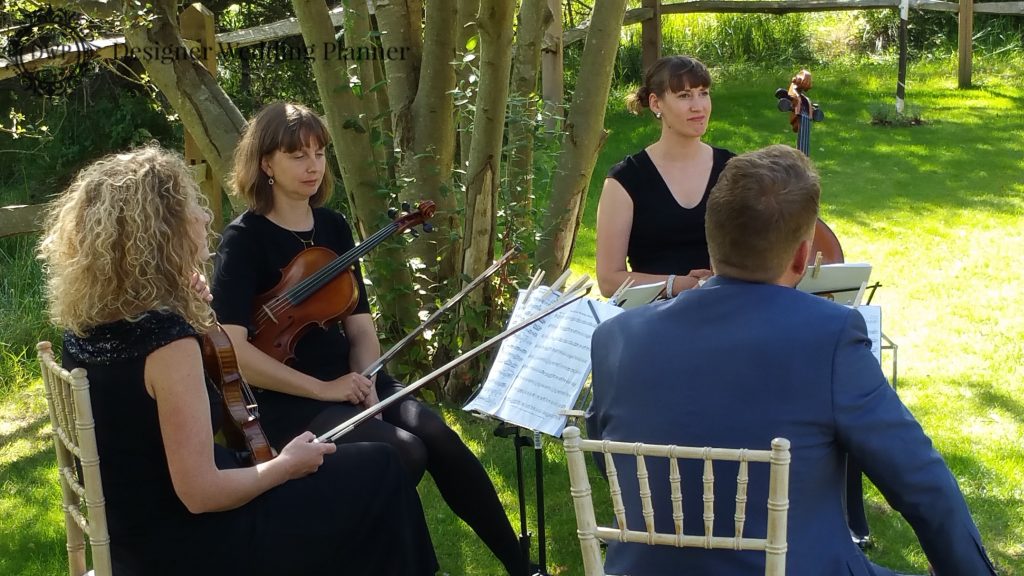 The 4 Piece String Quartet played the wedding march